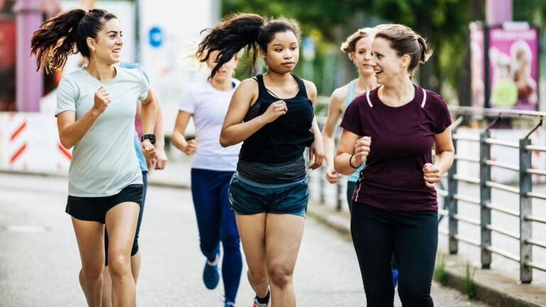 Group of runners talking as they run